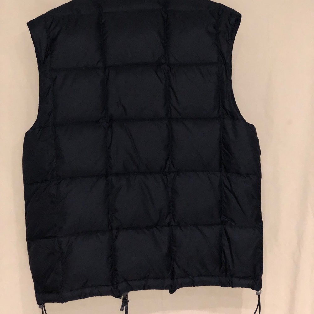 Burberry Vest to add some chic to your fit.
